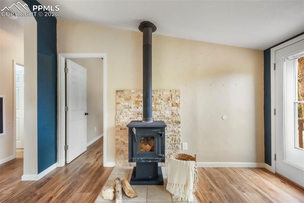 Detailed view of a wood stove and wood finished floors