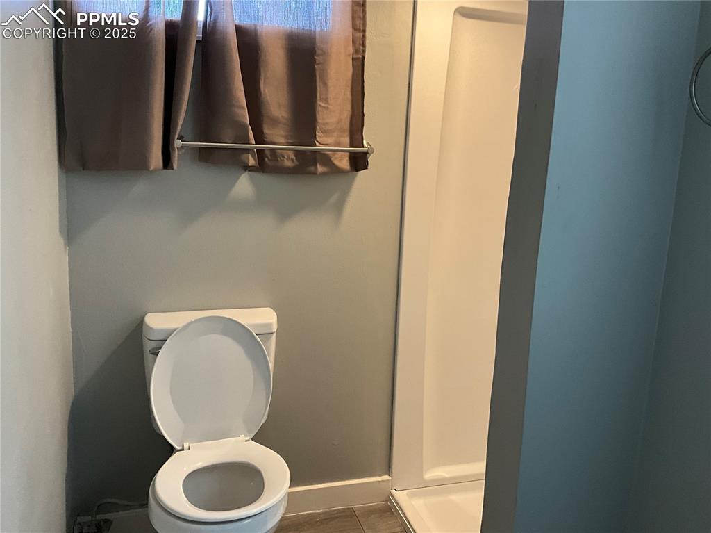 Bathroom with toilet and a shower stall