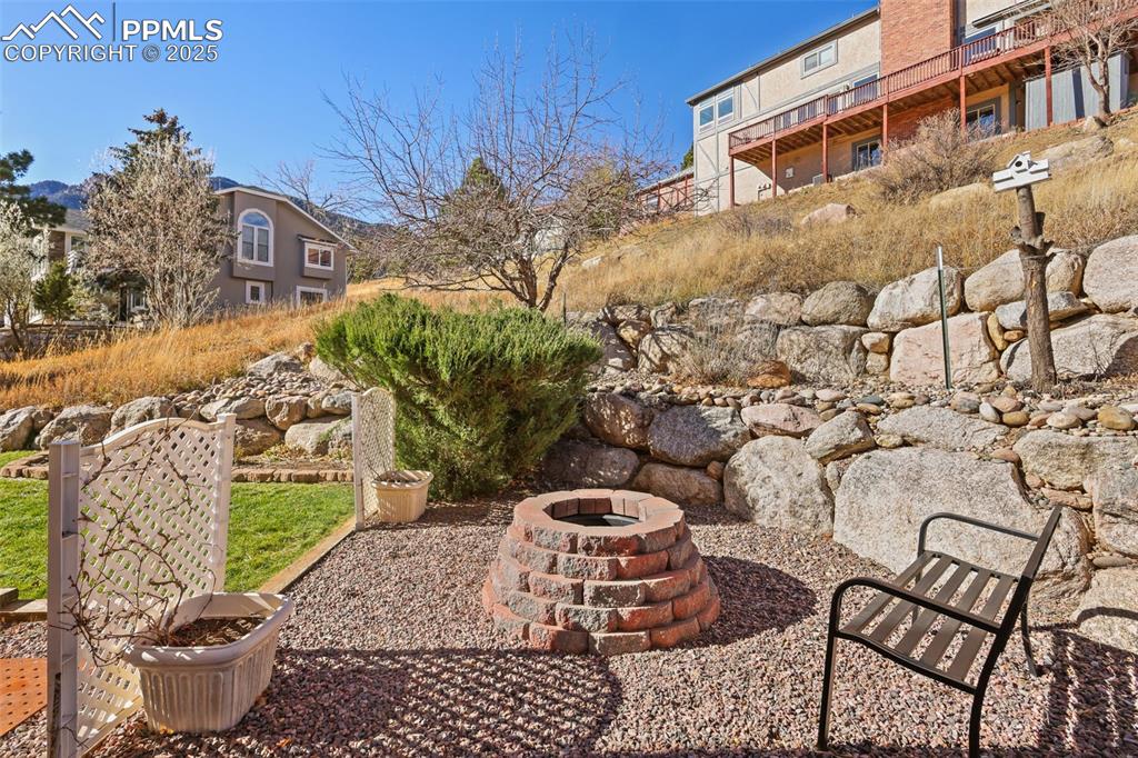 View of patio / terrace with an outdoor fire pit