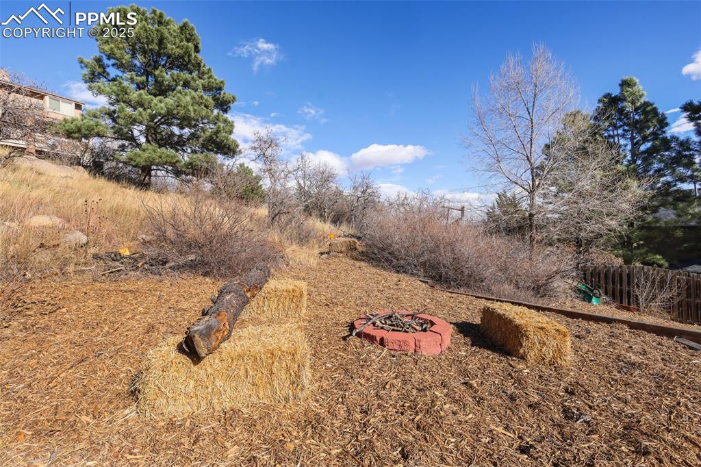 View of yard featuring a fire pit