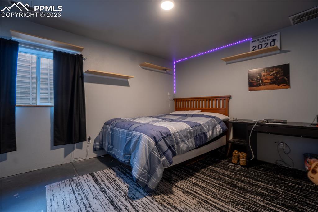 Bedroom with concrete floors