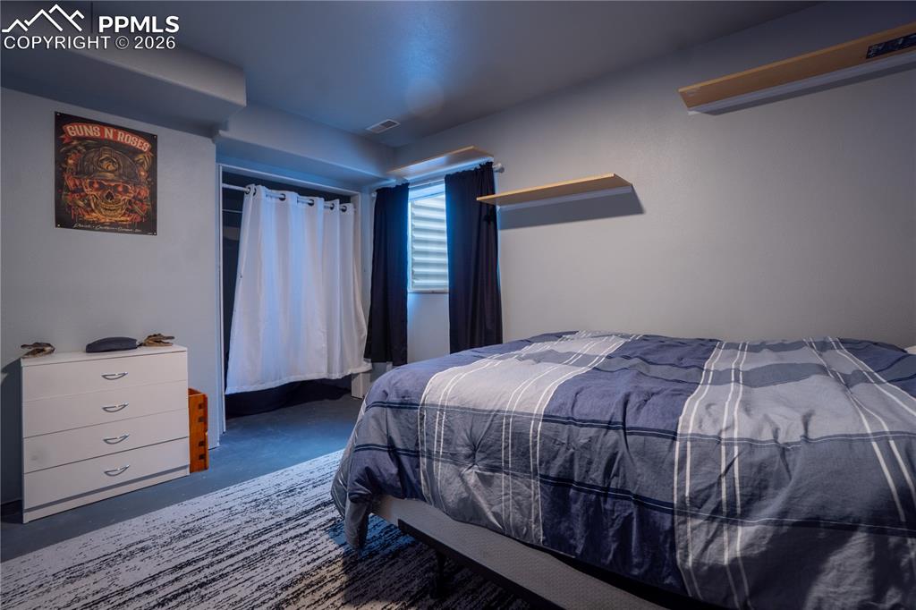 Bedroom with concrete floors