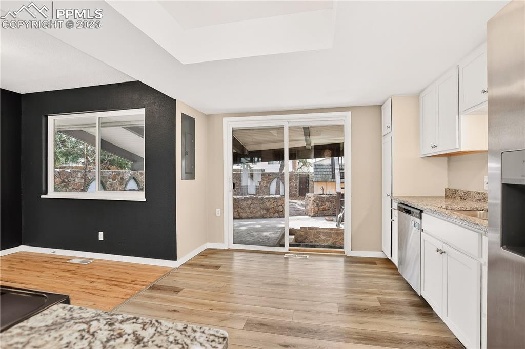 Sliding glass door access to the covered patio and backyard.