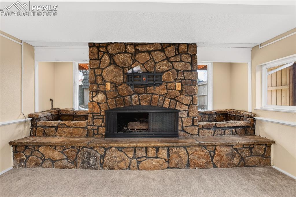 Gas fireplace featuring built-in planters.