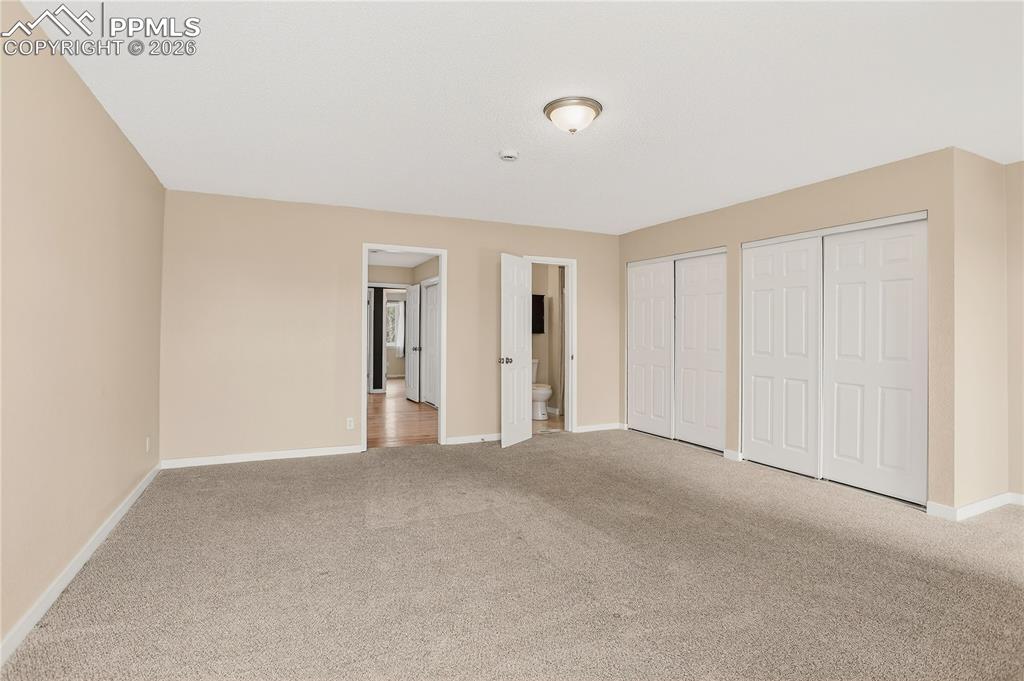 Spacious primary bedroom with generous closet space.