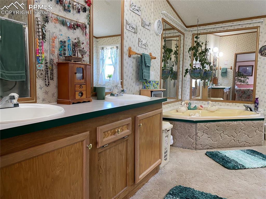 Relax in your elegant primary bathroom with a large soaking tub, 