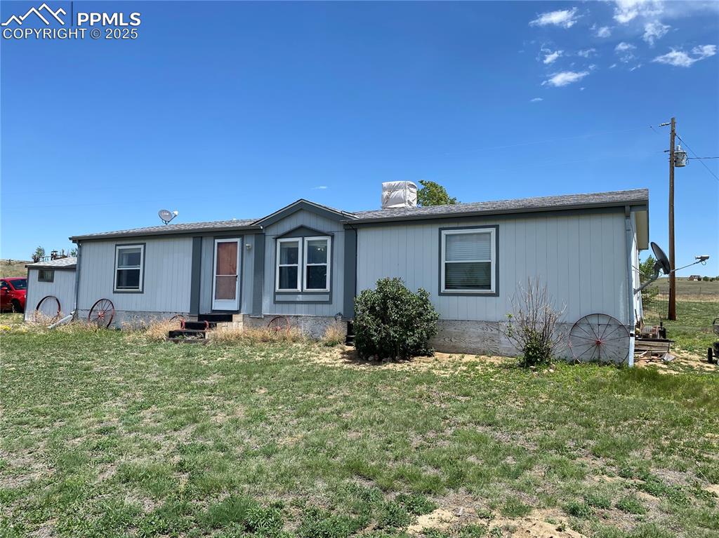 Front view of the home with picturesque surroundings