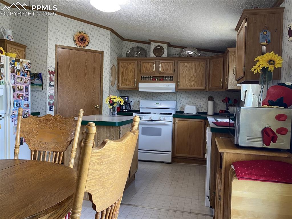 Spacious kitchen with a bright dining area and a large pantry