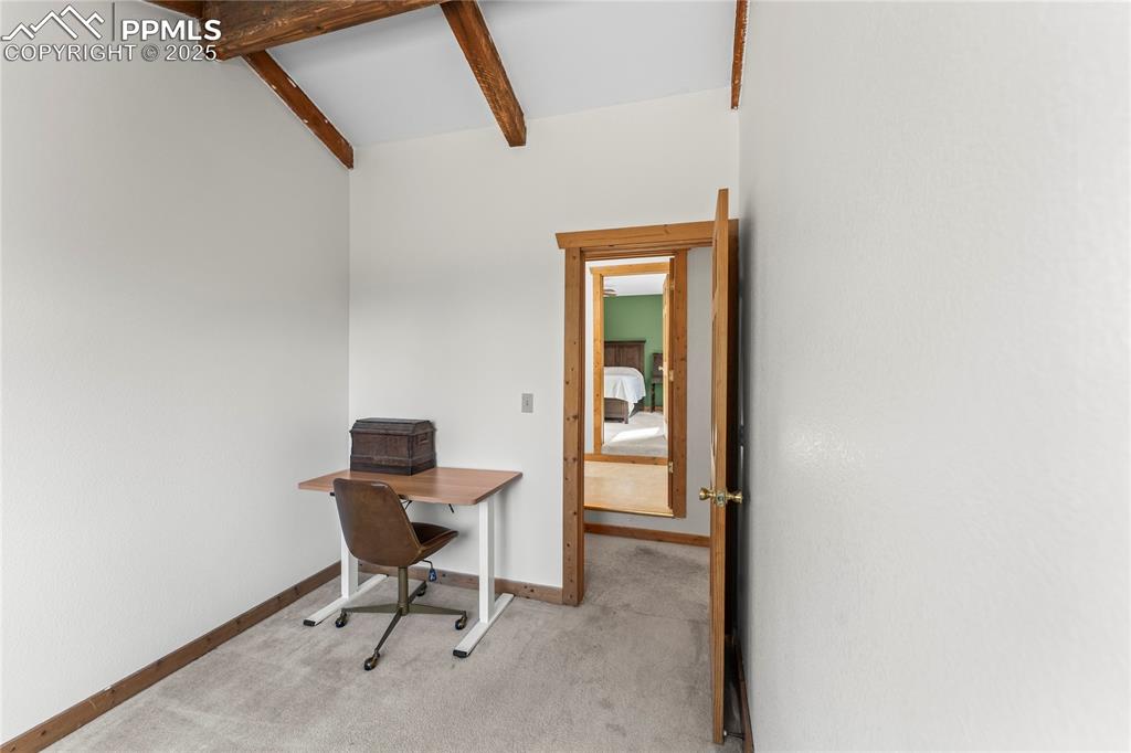 Office space featuring carpet floors and baseboards