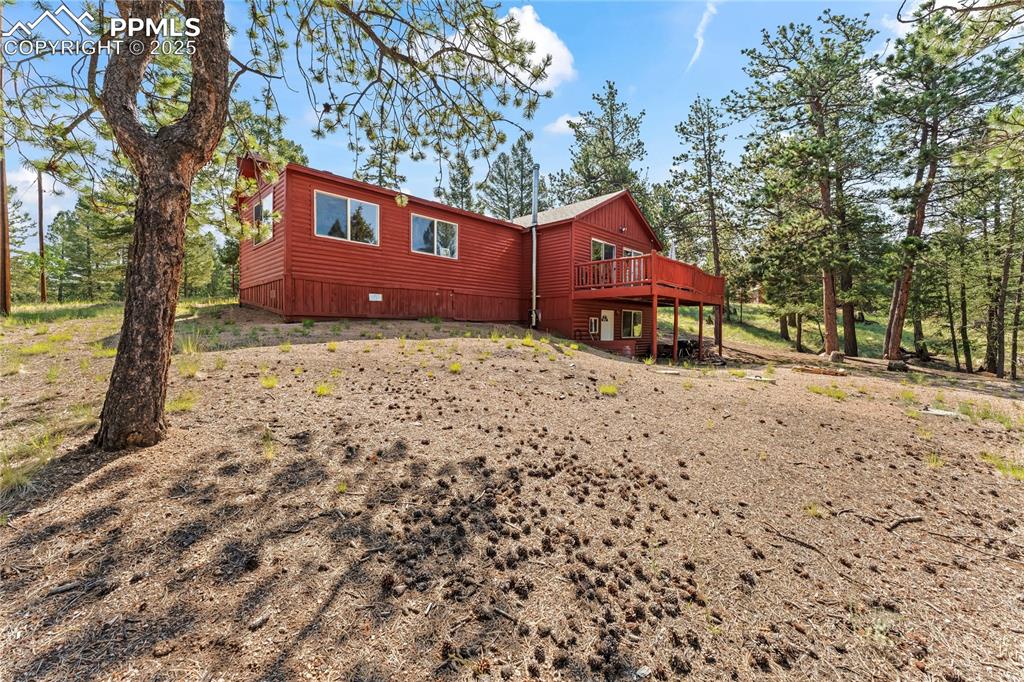 View of home's exterior featuring a deck