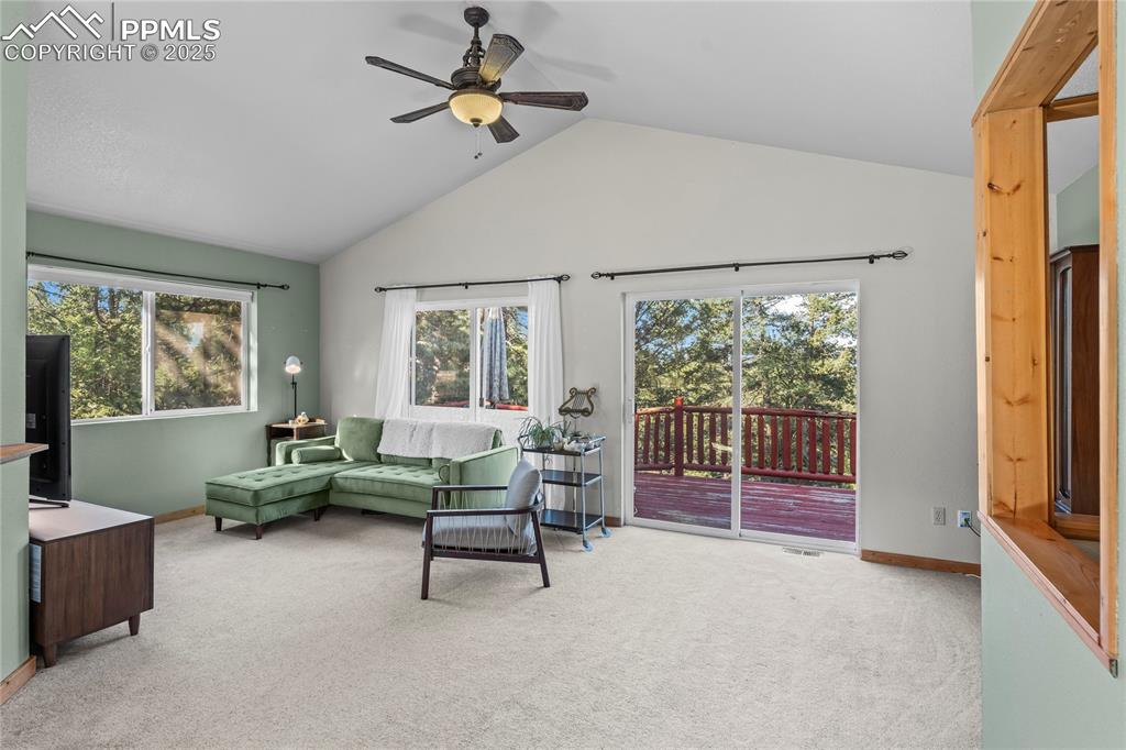 Living room with dual sliding doors to back deck