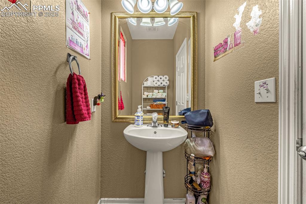 Bathroom featuring a textured wall