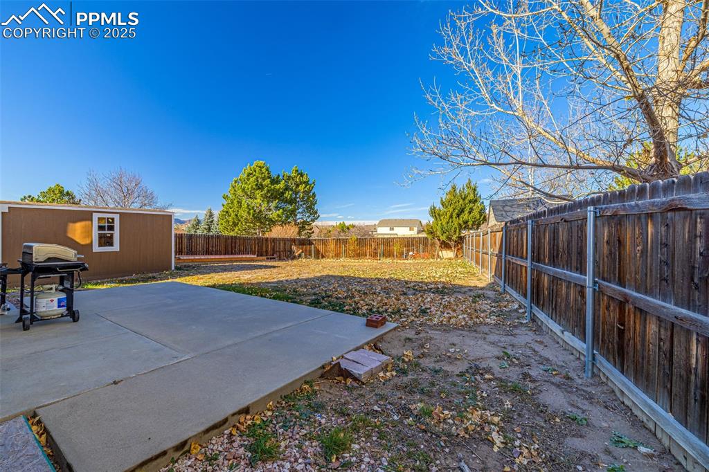 Fenced backyard featuring a patio area
