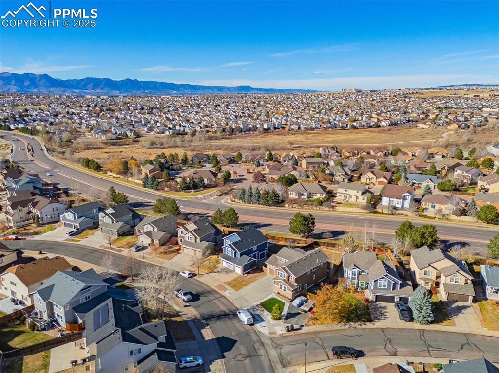 Aerial perspective of suburban area with mountains