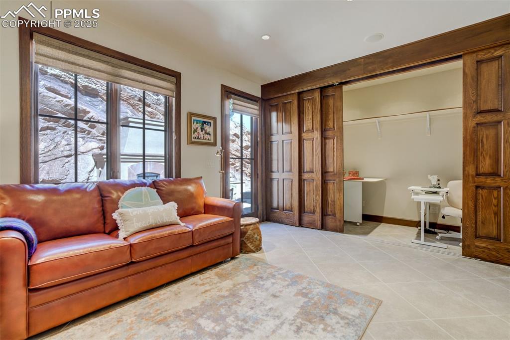 Main level bedroom with 5 door closet/craft area