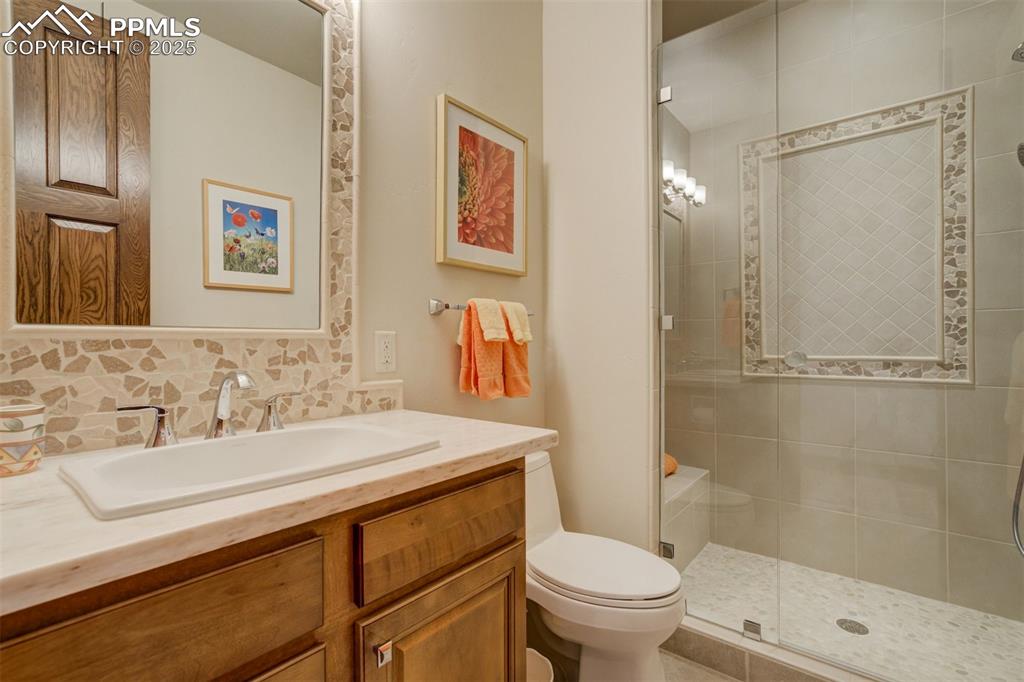 Main level bathroom with a shower