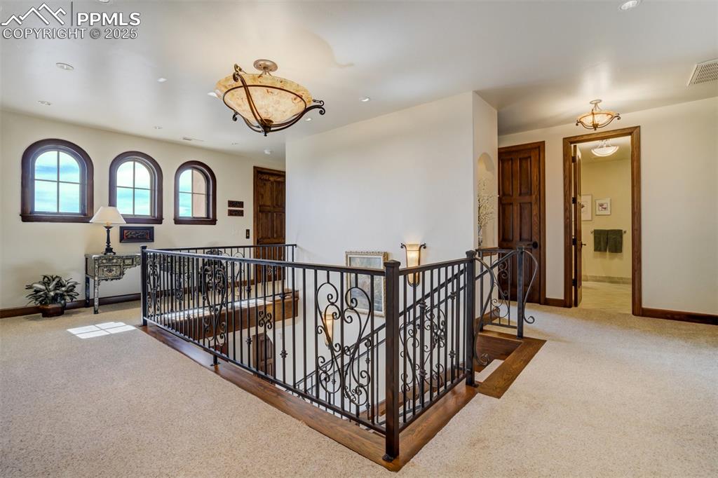 Arched windows above and second floor elevator landing with wheelchair accessible area