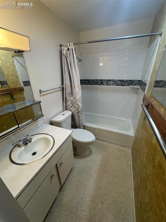 Full bathroom with vanity and shower / bath combination with curtain