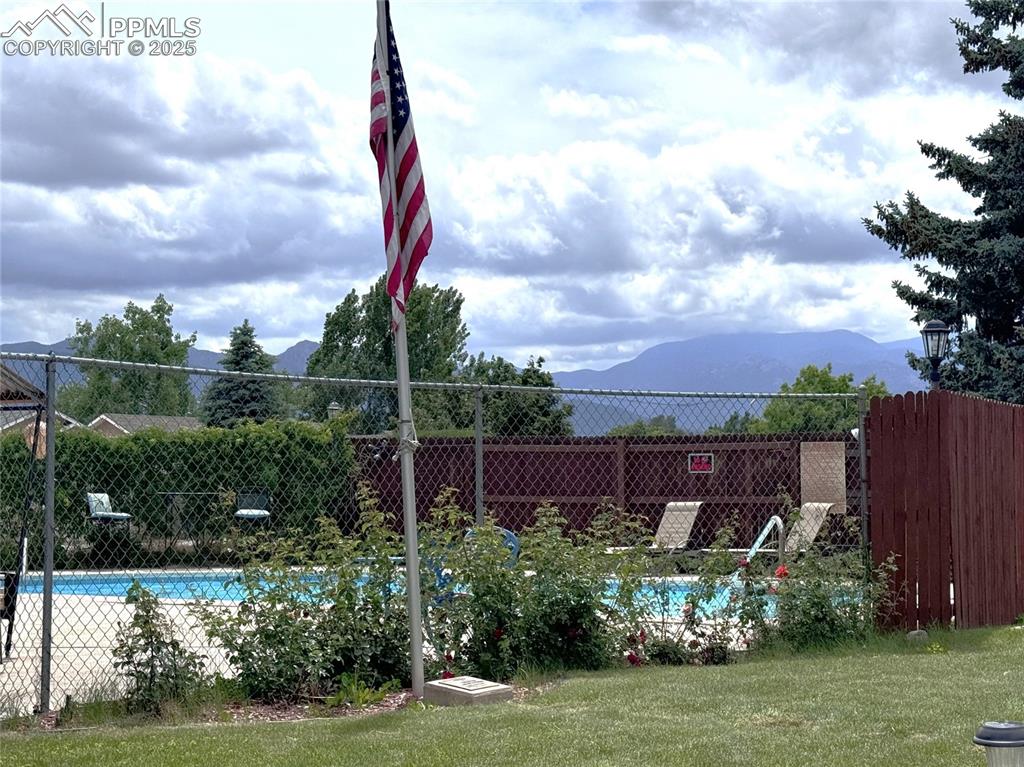 Community pool featuring a mountain view