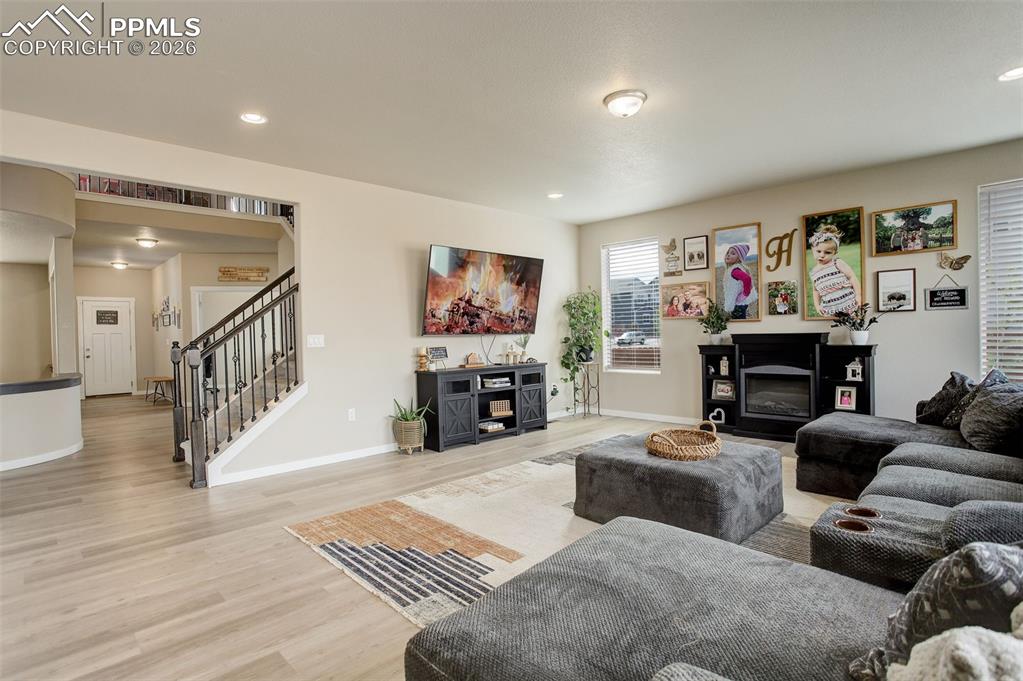 Main level; Living area with light wood finished floors and recessed lighting
