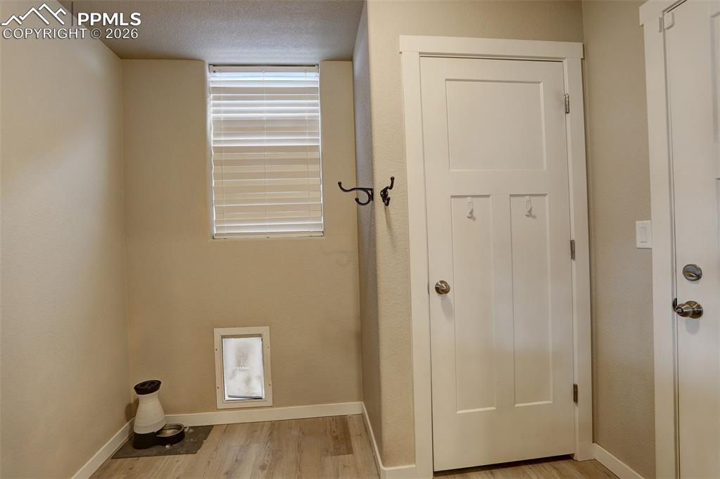 Main-Level; mud room with coat closet, dog door to dog run and door to garage, double car garage. one of two garages. 