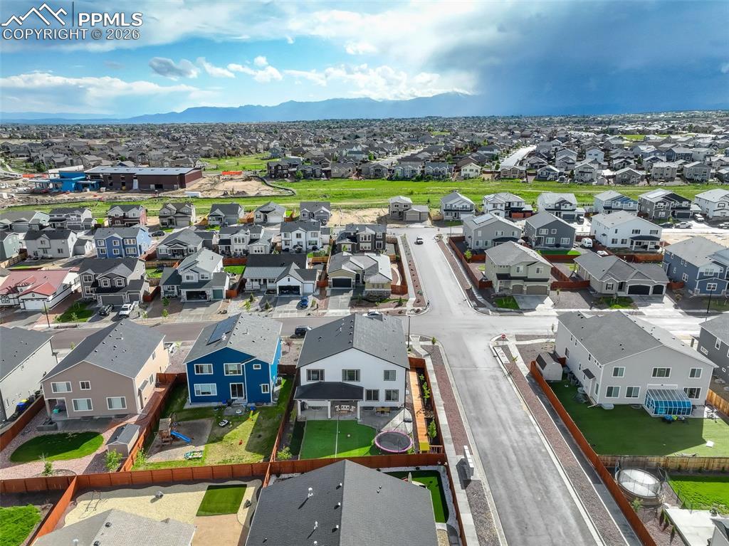 Aerial view of residential area with a mountain backdrop