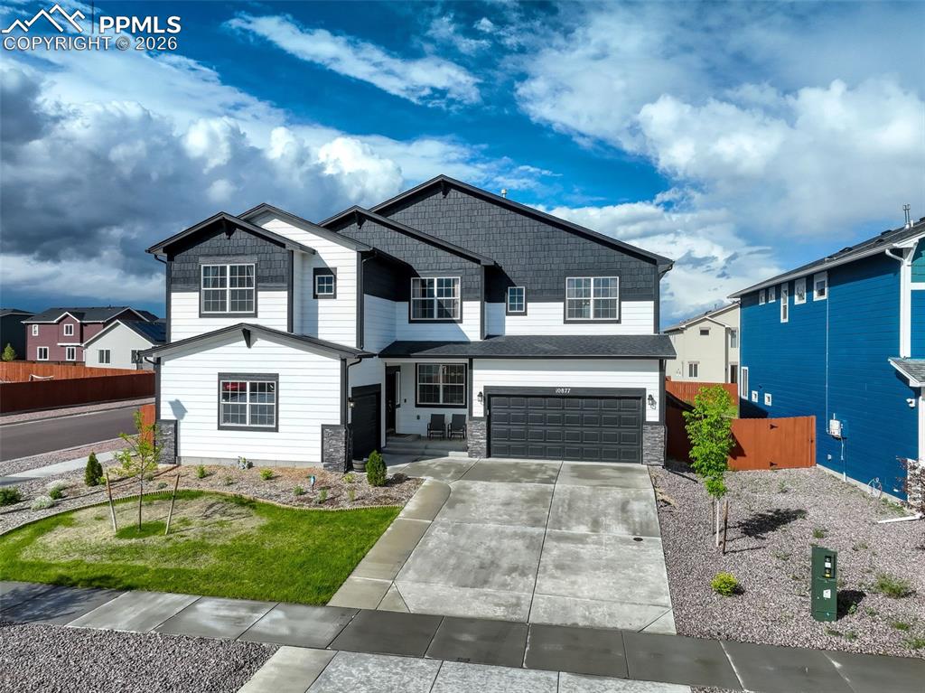 Craftsman house featuring corner lot - three garage spaces. Single and double. 