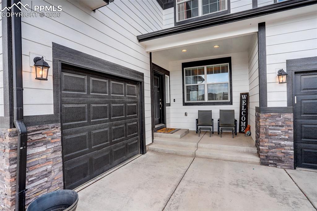 View of exterior entry - near single car garage (1 of 3 parking garages. This adjoins into home at the foyer - for private access. 