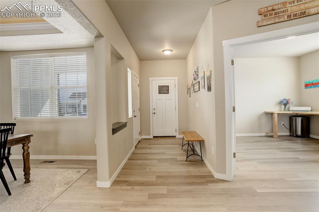 Foyer entrance featuring white oak LVP flooring.