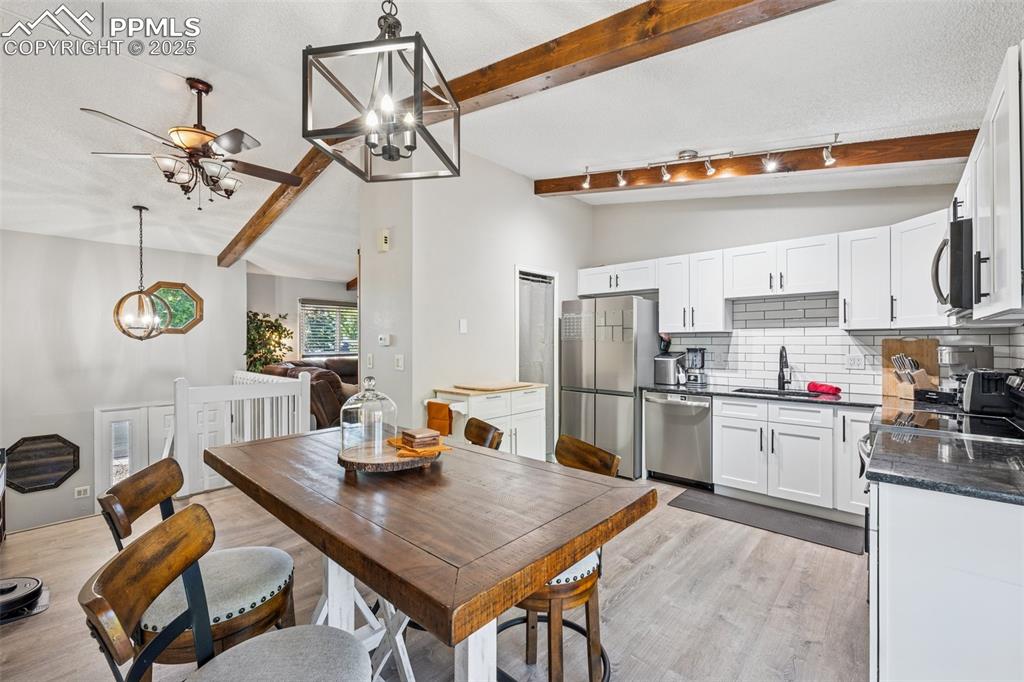 Dining room with a chandelier and light wood-type flooring