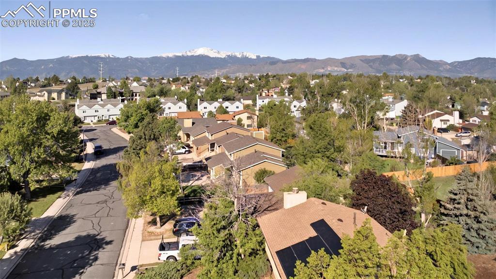 View of property location with a mountainous background and nearby suburban area