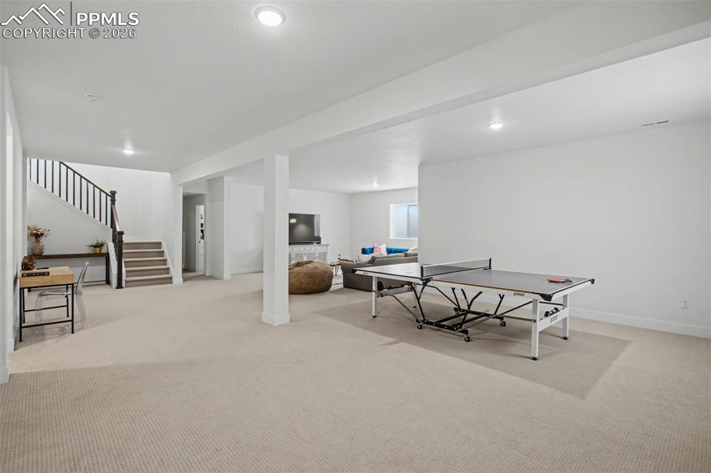 Rec room featuring light colored carpet and recessed lighting