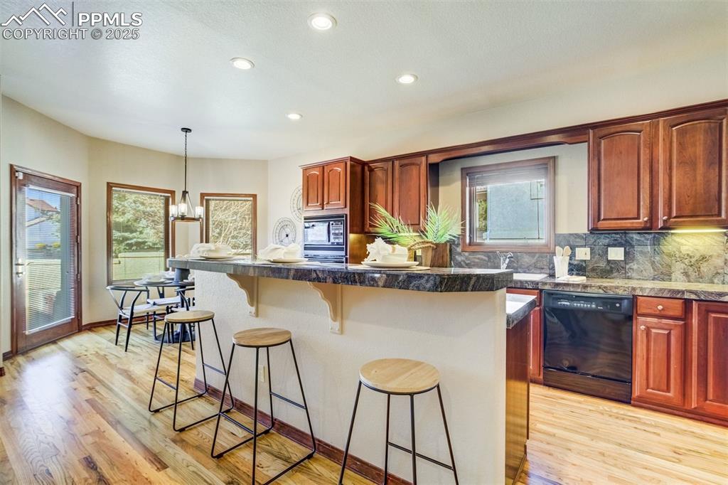 Open kitchen with Oakwood floors. 