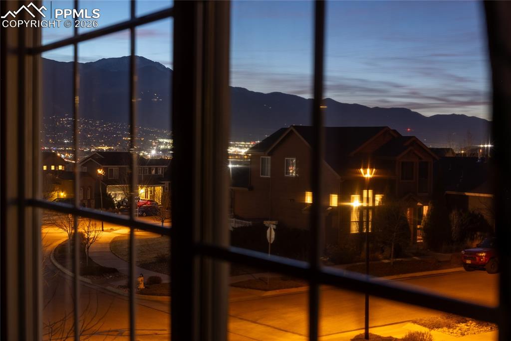 Evening view of Pikes Peak and neighborhood lights from upstairs window.

