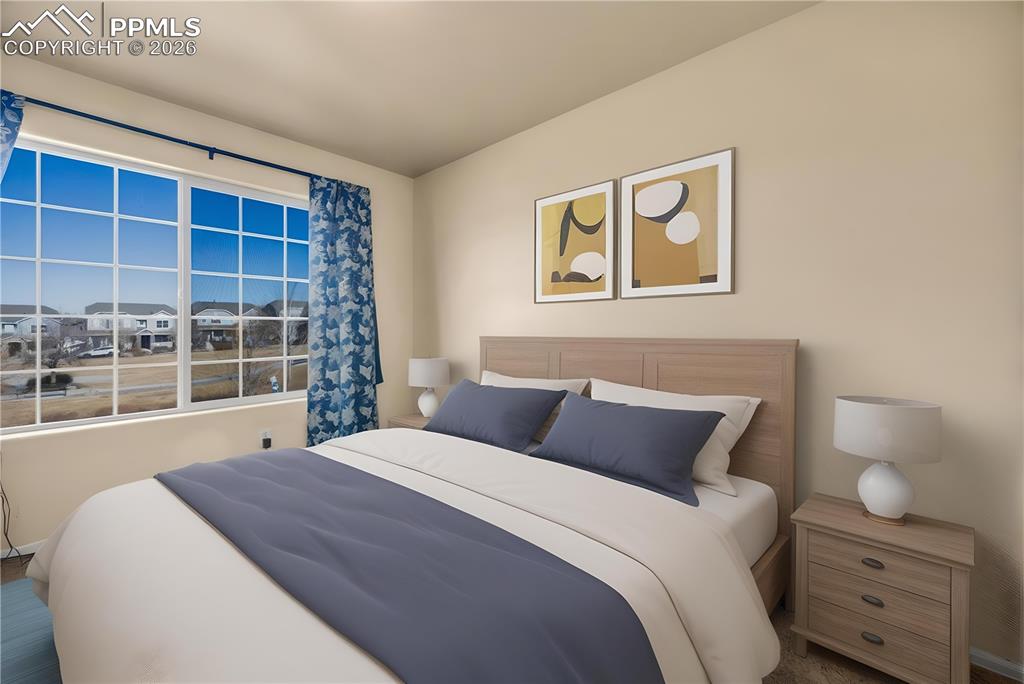 Spacious full bath with extended vanity, tile floors, and modern lighting.