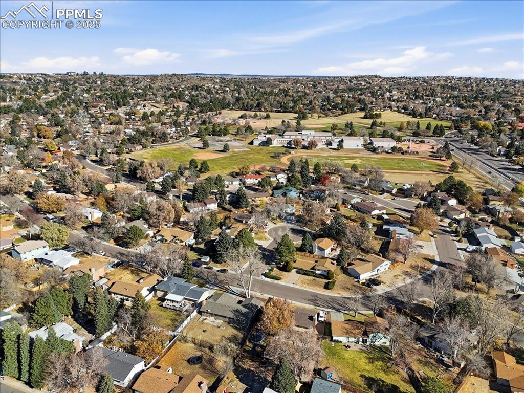 Aerial view of property's location with nearby suburban area