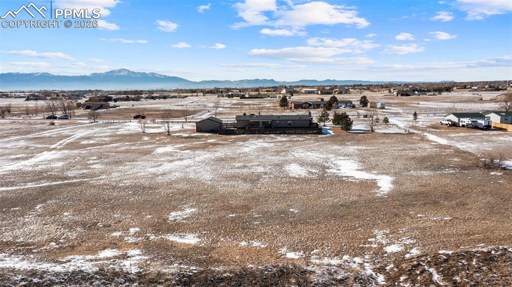 Snowy aerial view with a mountain view