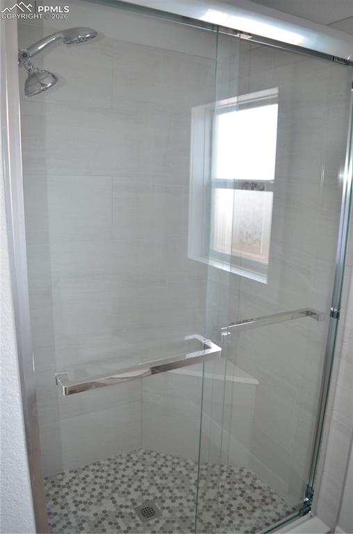 Bathroom with a shower with door