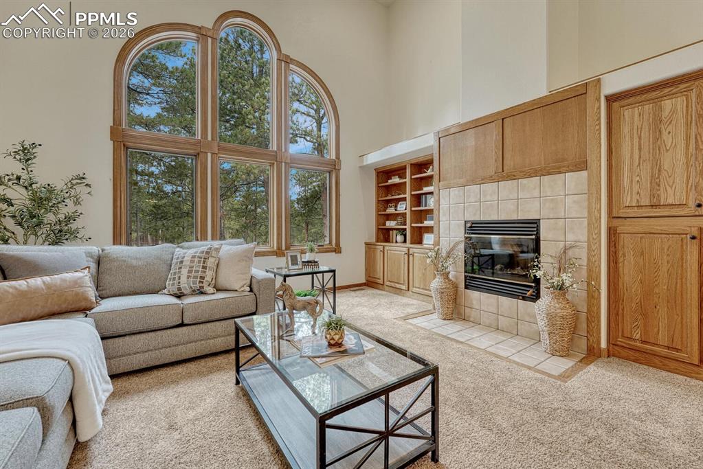 The Family Room offers custom built-ins and a wood-burning fireplace for cozy evenings.