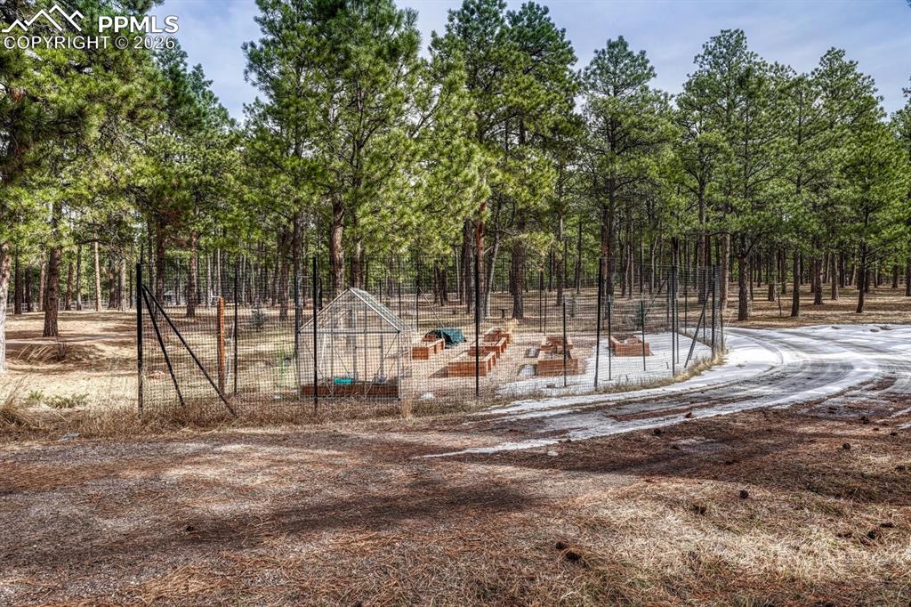 Raised irrigation planter beds and green house for the garden enthusiast.