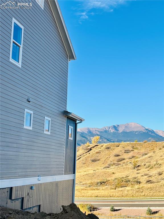 View of property exterior featuring a mountain view