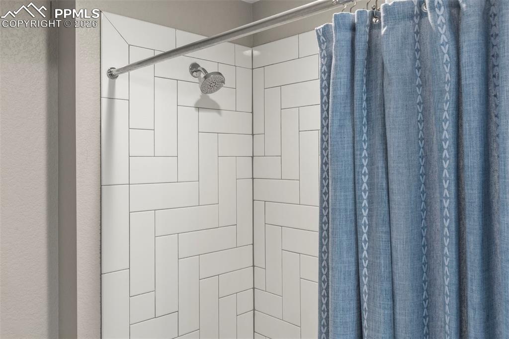 Decorative tile in shower and bathroom floor in 2nd Full bathroom 