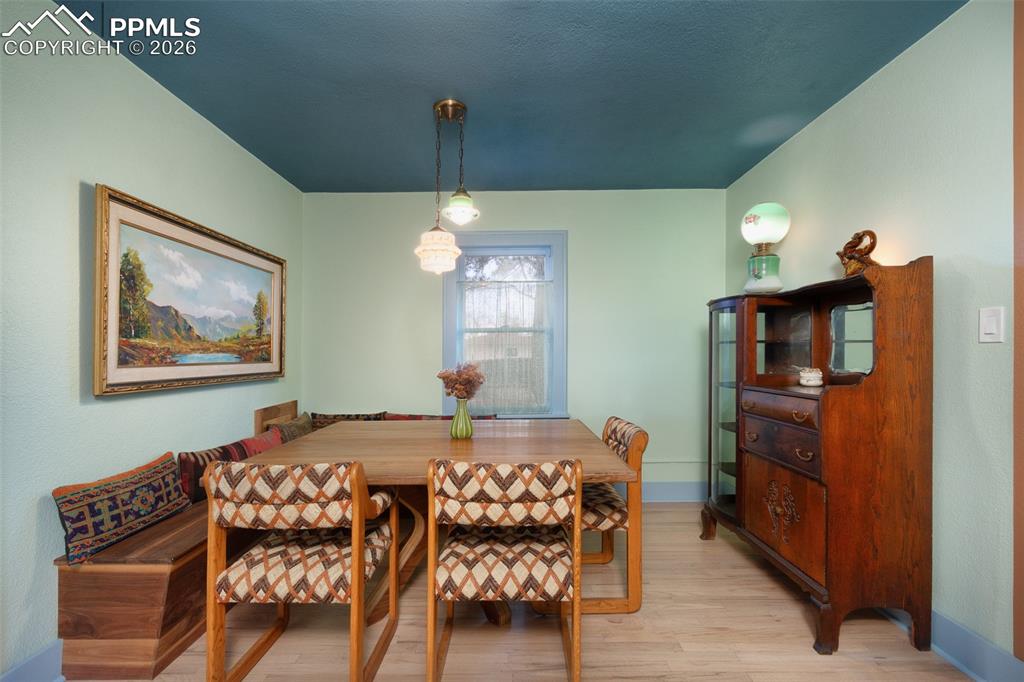 Dining room with custom built dining table and built in bench that will stay with the property