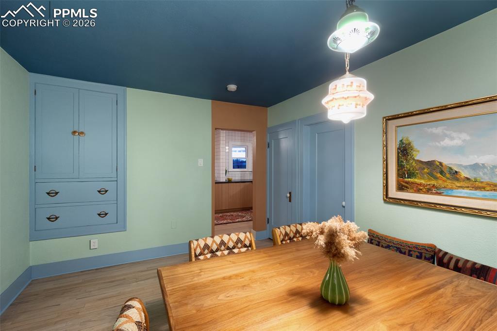 Dining room with custom built dining table and built in bench that will stay with the property