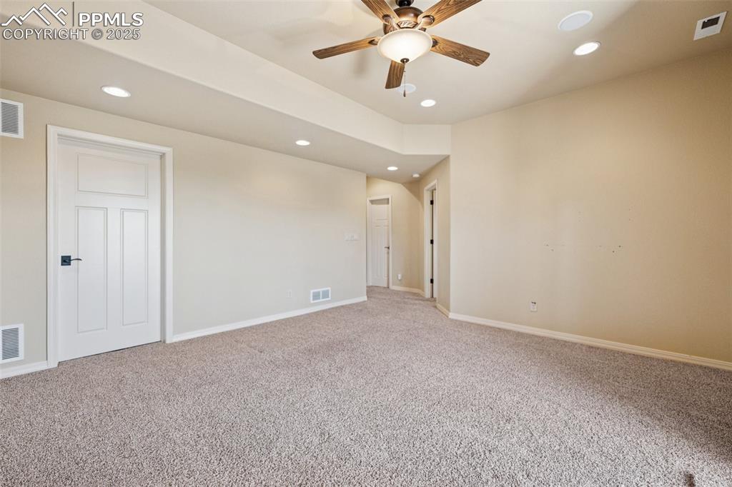 Unfurnished room with light carpet, recessed lighting, and a ceiling fan
