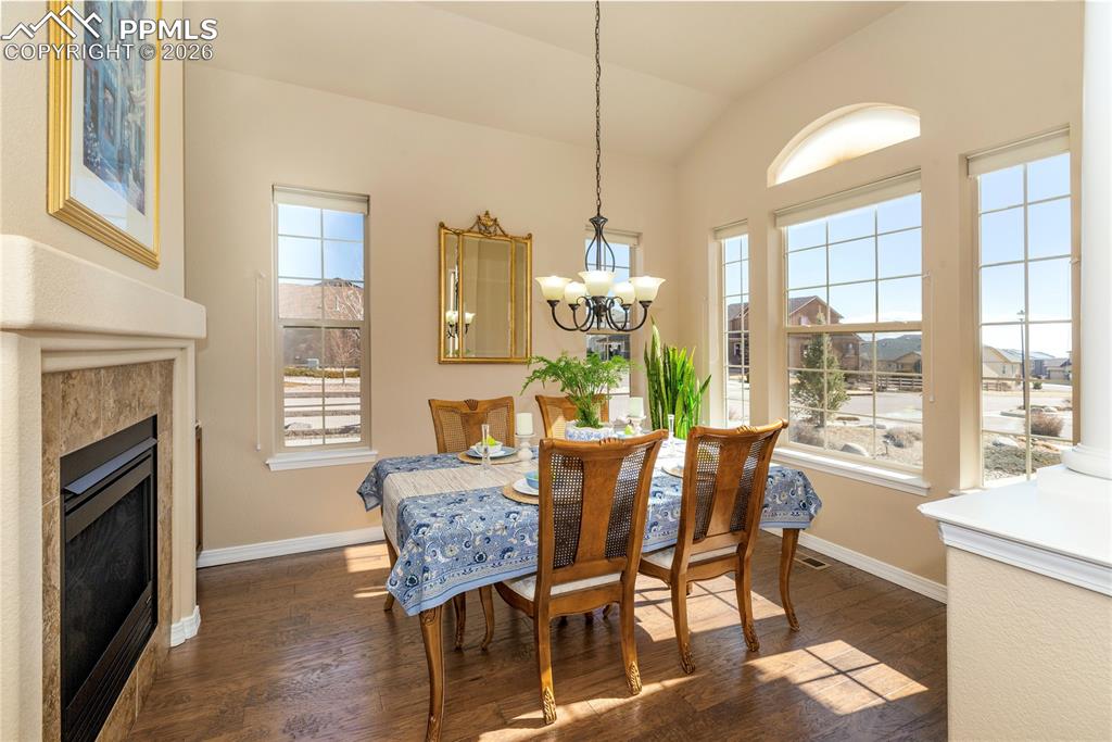 Sunroom-inspired dining area with a vaulted ceiling and an abundance of natural light.