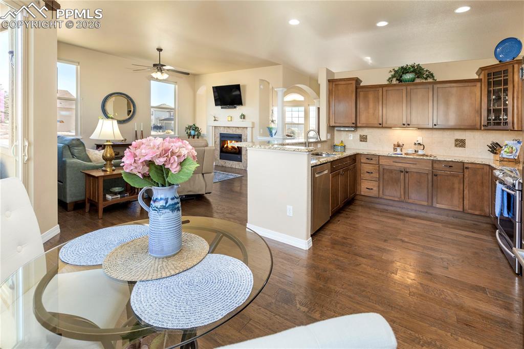 Beautiful kitchen with breakfast bar, maple cabinets, 5" plank hickory wood floors, and eat-in dining nook.