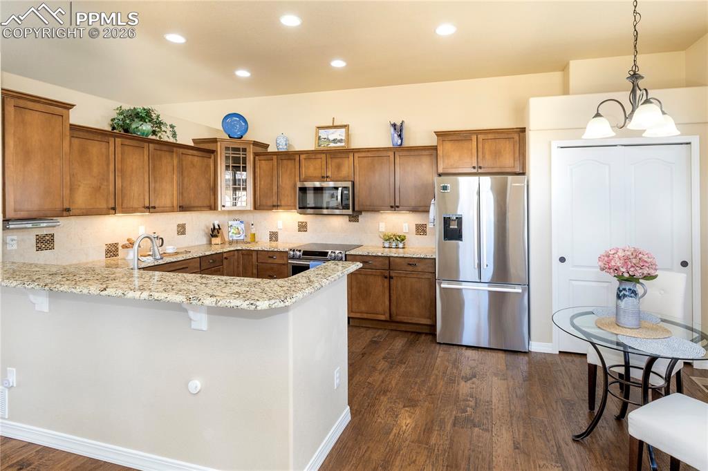 Bosch 26 Cu Ft French Door refrigerator and double pantry with custom shelving.