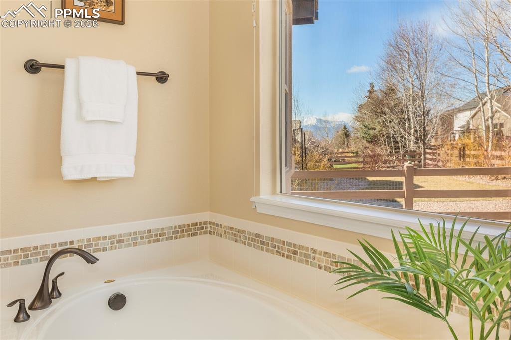 Spa-like bathroom with deep, soaking garden tub.