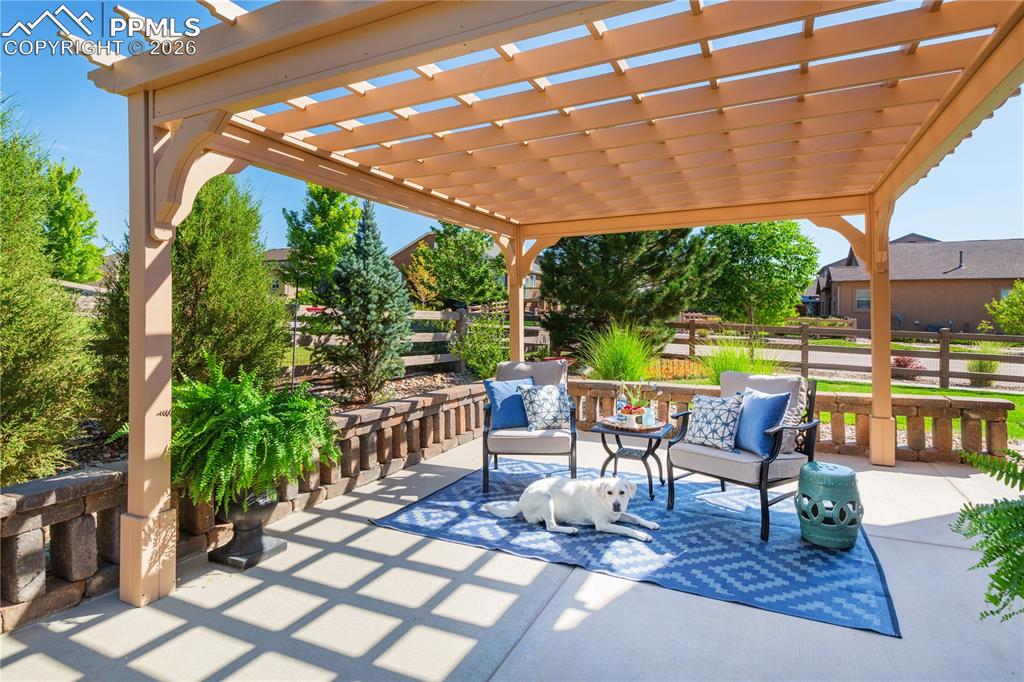 Ready to enjoy this summer with an enclosed backyard, custom pergola, expanded patio area, and gorgeous landscaping.